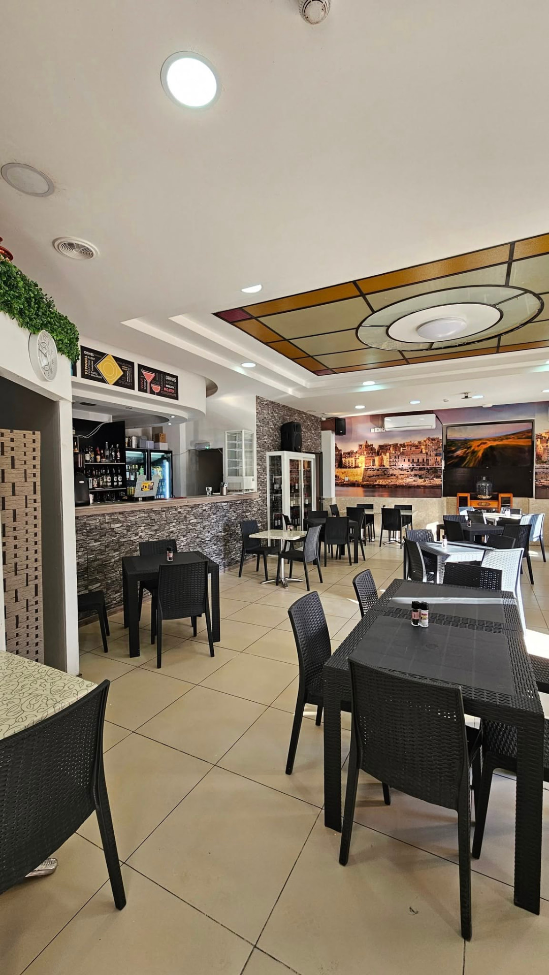 Clean and welcoming indoor dining room at La Rabtija